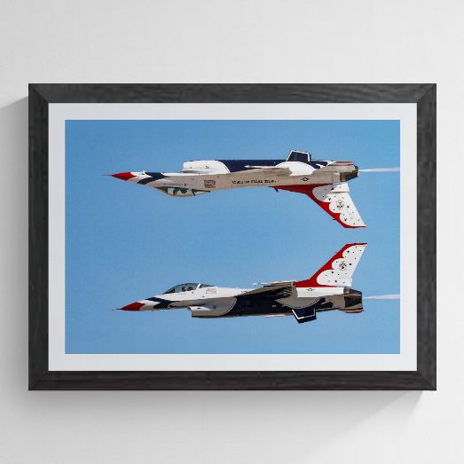 Limited edition U.S. Air Force Thunderbird F-16 photography print titled "Calypso Pass" by Phil Schmauder at Nellis AFB, professionally presented in a textured black gallery frame with a wide white mat against a light gray background.