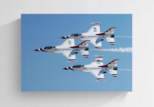 Triad Precision archival high-gloss aluminum metal print by Phil Schmauder for PES Editions, featuring a rare three-ship USAF Thunderbirds F-16 flight formation over Nellis AFB, displayed as a frameless modern aviation art installation.