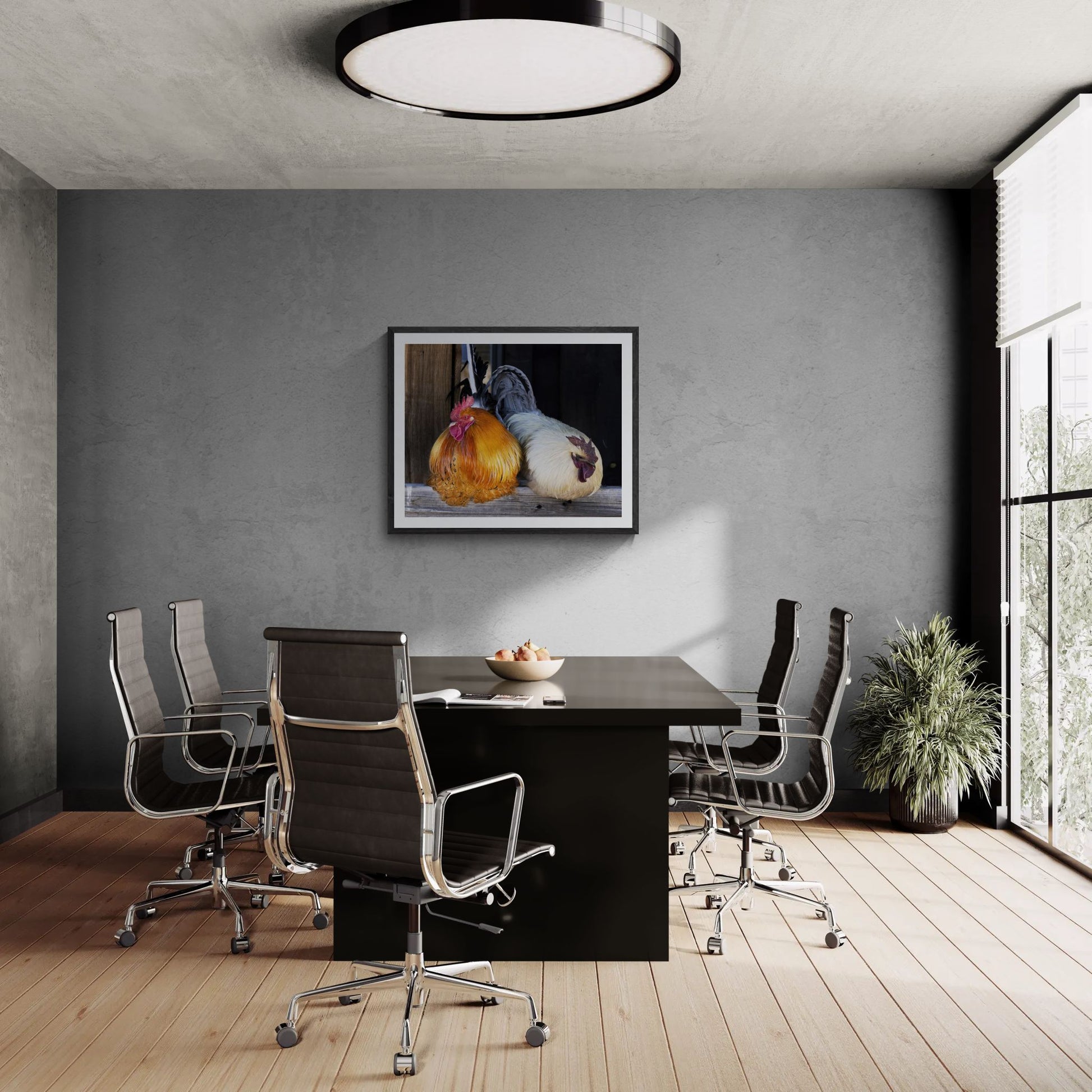 A large-scale 40x32 "Statement Edition" of "The Sentinels" barnyard print commanding a professional boardroom. The artwork is displayed in a textured black frame on a grey concrete feature wall, highlighting its rich color, high-fidelity plumage detail, and presence in a luxury interior space.