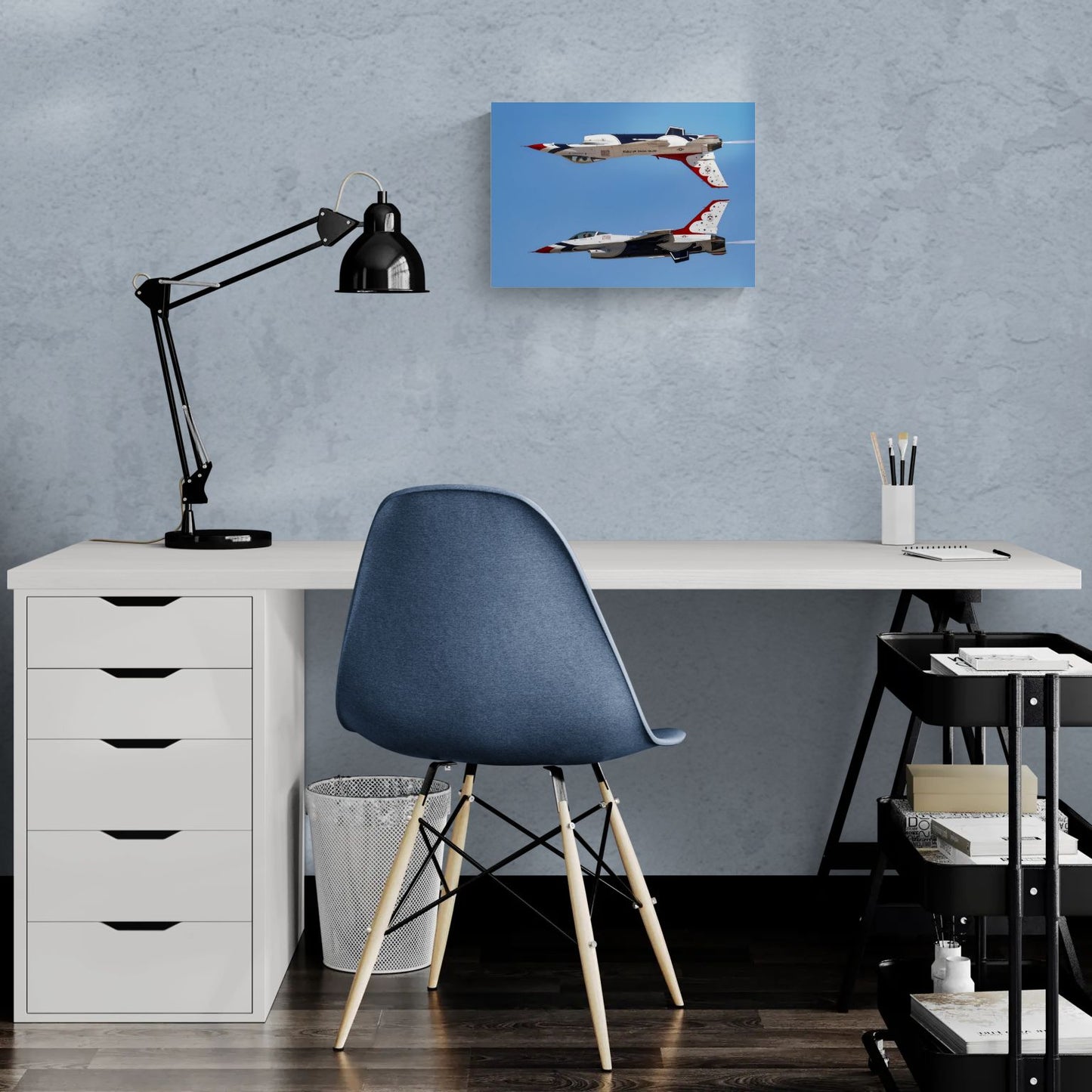 Sleek home office layout displaying a clean-edge, float-mounted metal aviation photograph titled Calypso Pass hanging over a modern white desk setup, showcasing contemporary military art decor.