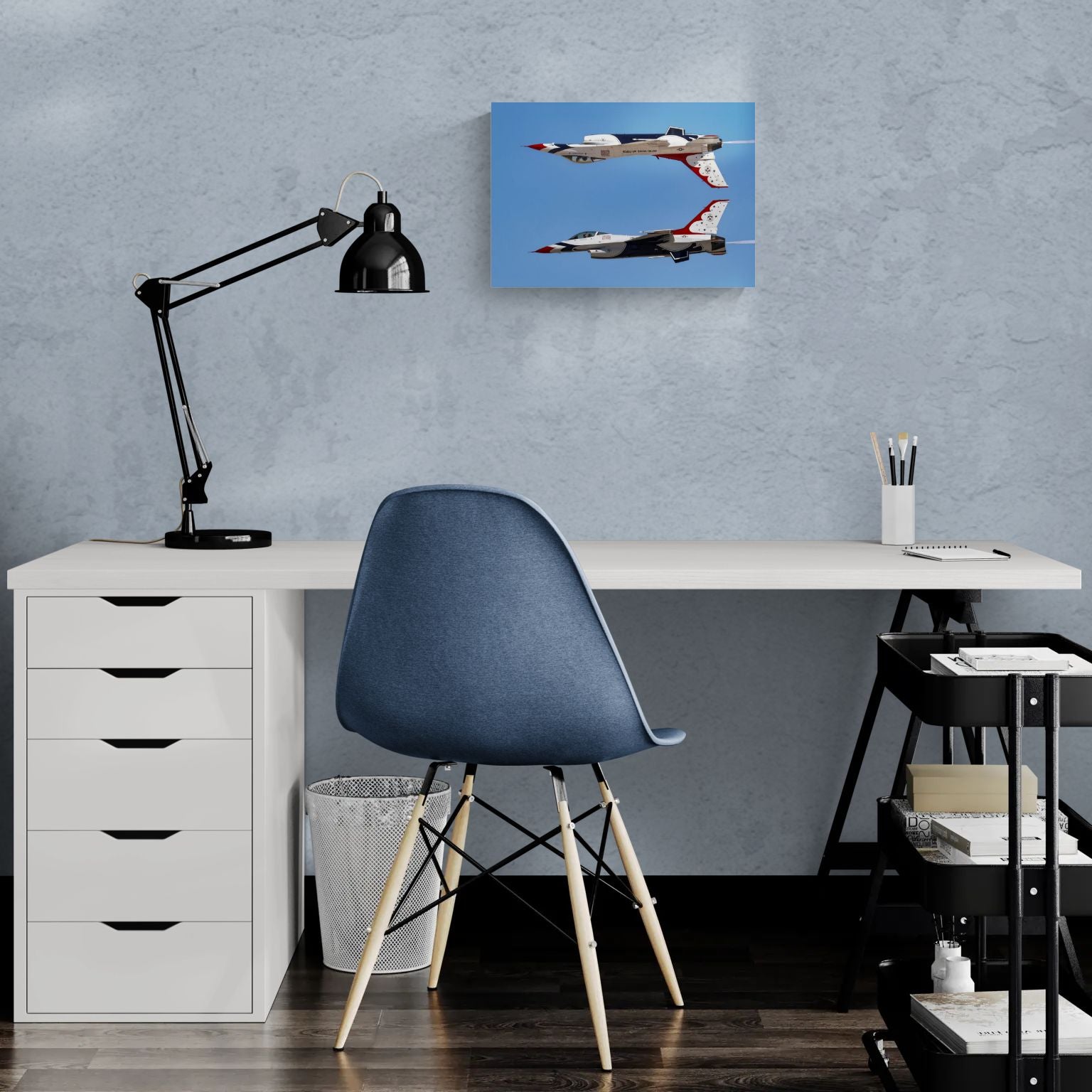 Sleek home office layout displaying a clean-edge, float-mounted metal aviation photograph titled Calypso Pass hanging over a modern white desk setup, showcasing contemporary military art decor.