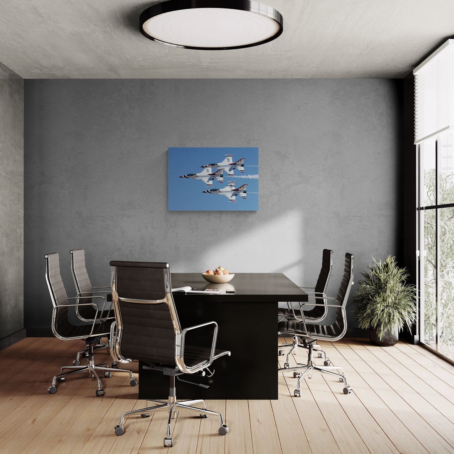Luxury corporate boardroom featuring a commanding, frameless Statement Edition metal print of a rare USAF Thunderbirds 3-ship pass, float-mounted on a dark concrete accent wall above a minimalist executive conference table.
