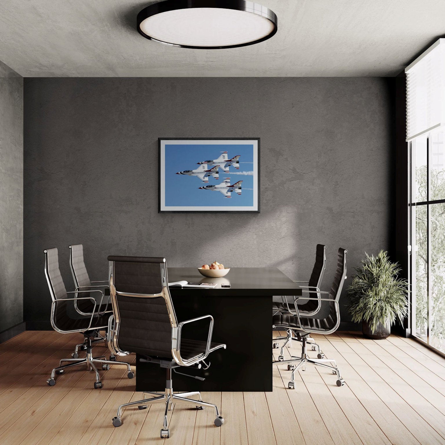 Large-format Statement Edition corporate boardroom wall decor display for Triad Precision by PES Editions, showcasing a framed 40x28 aviation photography print hanging centered on a dark concrete conference room wall above a black executive meeting table.