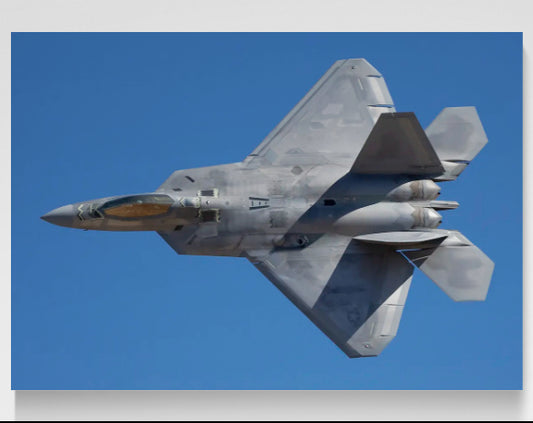 F-22A Raptor banking topside in blue desert sky, limited edition HD aluminum metal print with recessed float mount by Phil Schmauder for PES Editions.