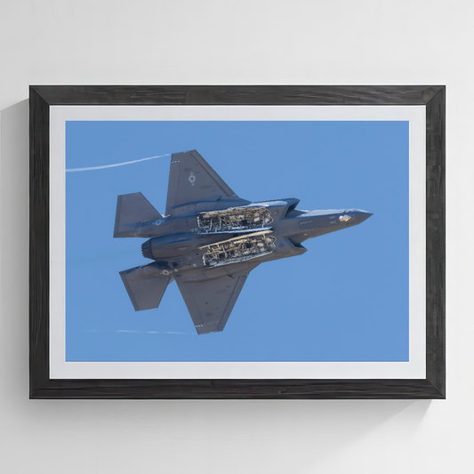 ine art print of an F-35A Lightning II jet  with weapons bay doors open.