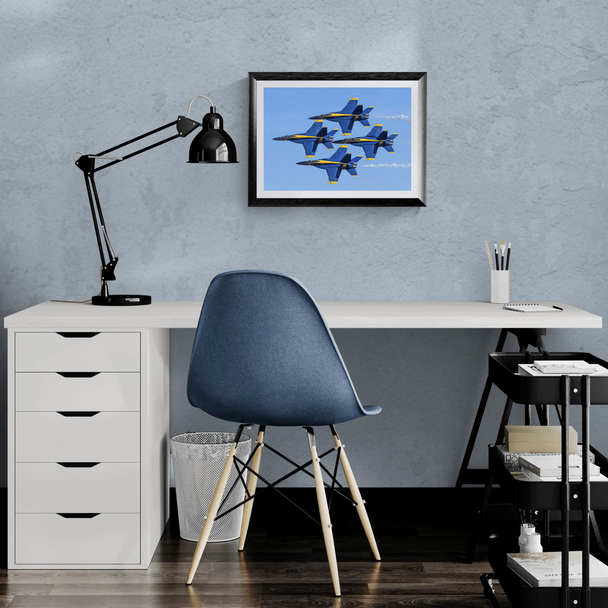 Blue Angels Diamond formation framed photograph displayed above a minimalist white office desk setup.
